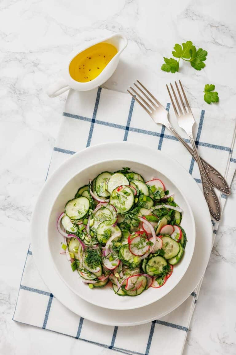A bowl of radish salad with a fork beside it.