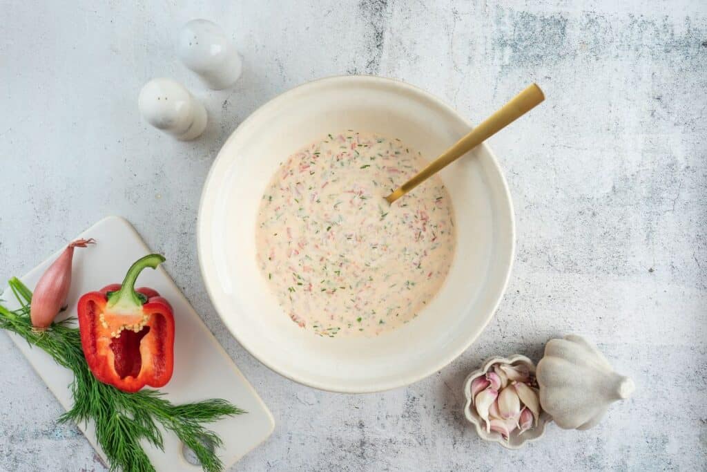 Mixed ingredients for Creamy Red Potato Salad with Pickle.