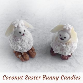Two Coconut Easter Bunny Candies made from coconut flakes, walnuts, and frosting are placed on a white surface.
