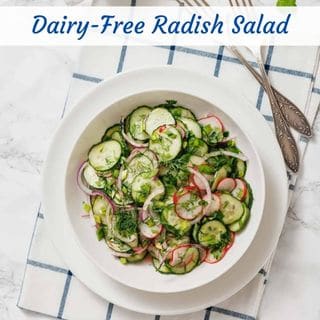 A bowl of radish salad with a fork beside it.