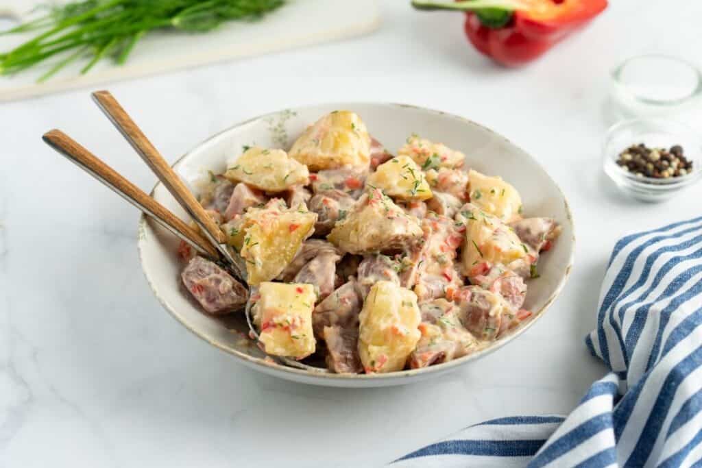 Creamy Red Potato Salad with Pickle in a bowl.