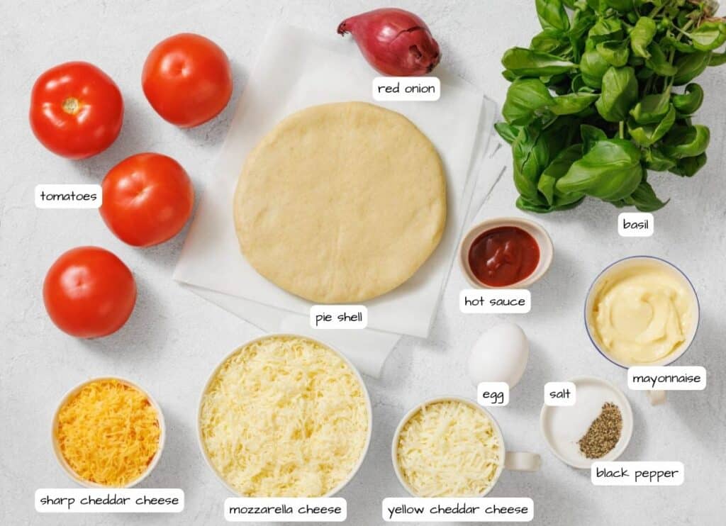 Overhead shot of pizza ingredients, including tomatoes, dough, sauce, cheese, egg, and herbs, arranged on a light surface with labels for each ingredient.