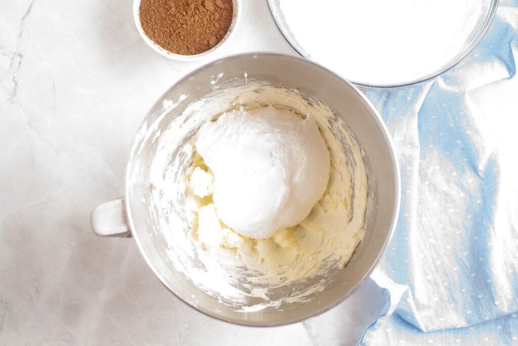 Beating the butter until light and fluffy.