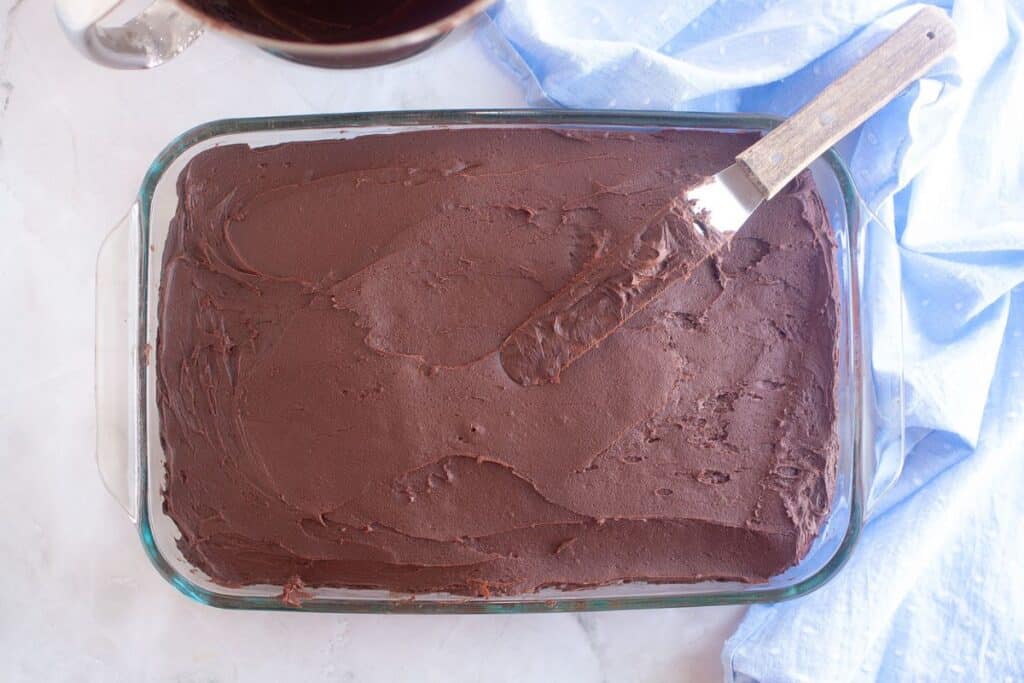 Placing it on the top and smoothing it.