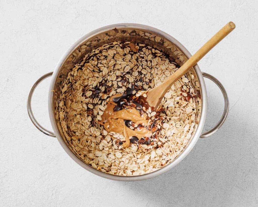 Adding and mixing oats on the mixture.