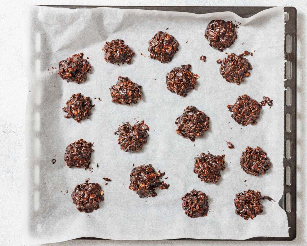 Photo of spoonfuls of the mixture onto the parchment-lined sheet