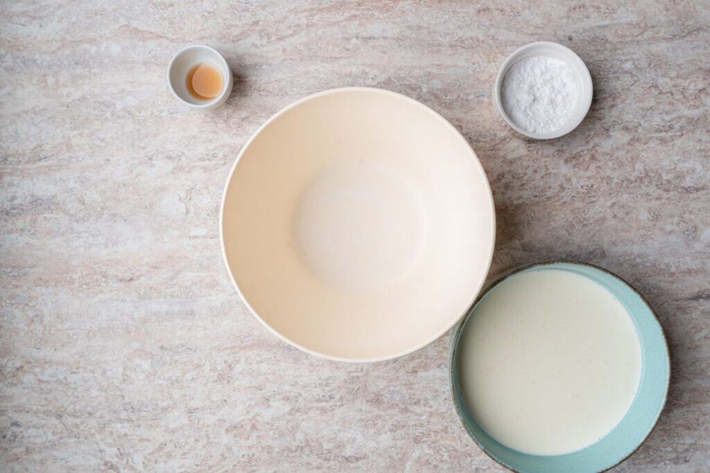 Preparing ingredients for a mixture for Creamy Key Lime Pie.