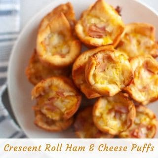 A white plate filled with ham and cheese puffs.