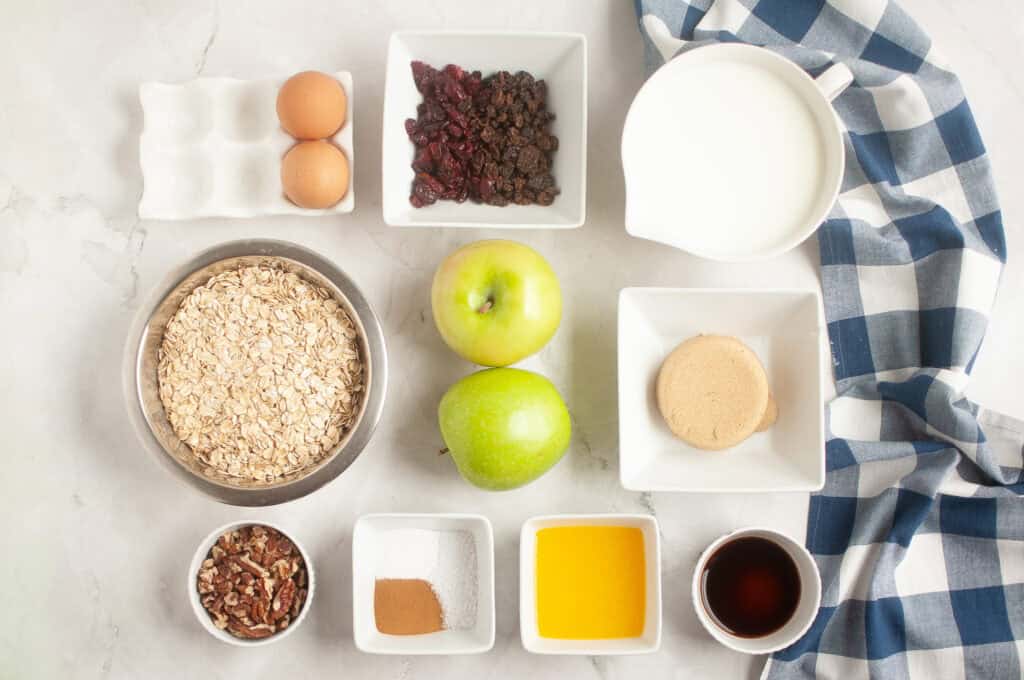 Overhead shot of ingredients for baked oatmeal with apples and cranberries.