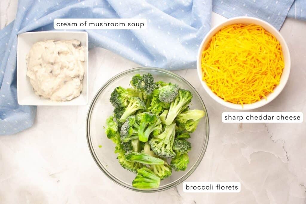 The ingredients for broccoli cheese casserole are in bowls.