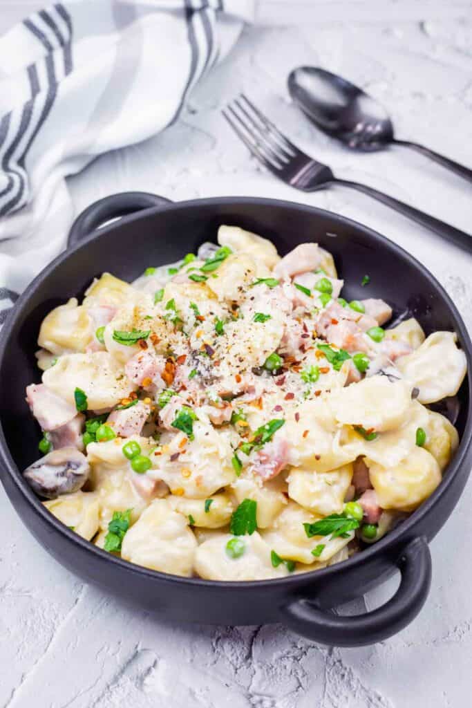 Photo of delicious Skillet Cheese Tortellini with Ham & Peas.