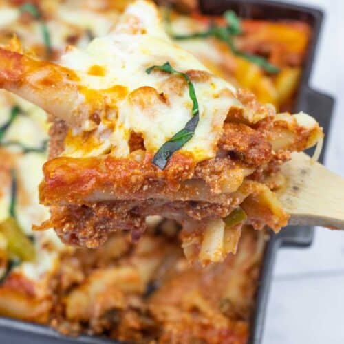 Cheesy lasagna in a baking dish.