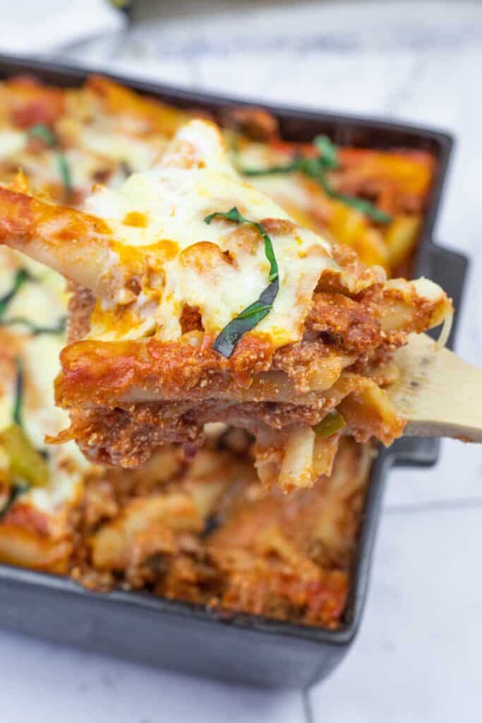 Cheesy lasagna in a baking dish.