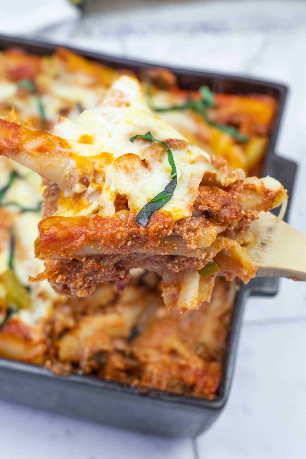Cheesy lasagna in a baking dish.