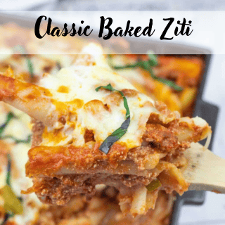 A close-up of a serving of classic baked ziti with tomato sauce, melted cheese, and basil, held above a baking dish.