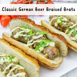 Three bratwursts in sesame buns topped with chopped herbs and a drizzle of creamy sauce, labeled "Classic German Beer Braised Brats.