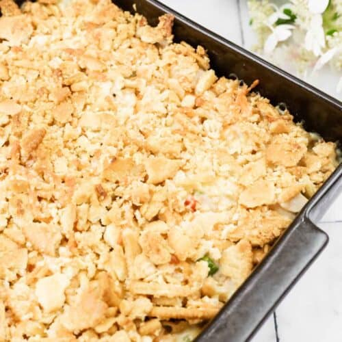 A casserole dish filled with crumbled bread.