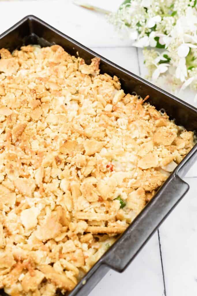 A casserole dish filled with crumbled bread.