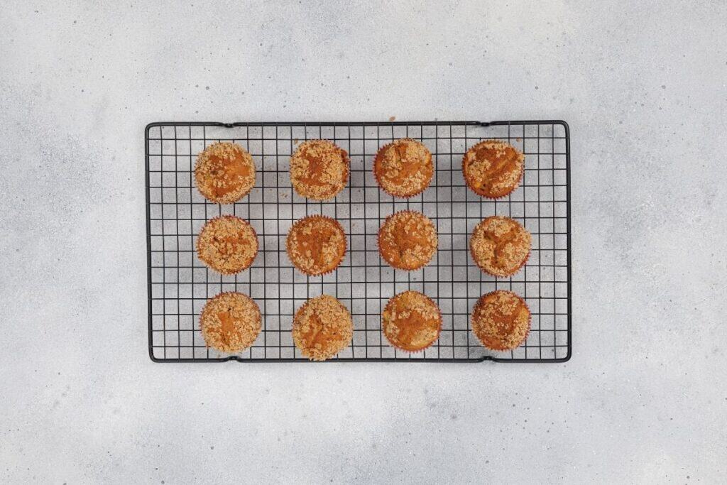 Crispy baked cupcakes cooling on a wire rack.