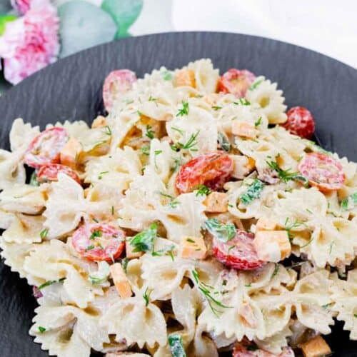 Classic Bacon Pasta Salad on a black plate.