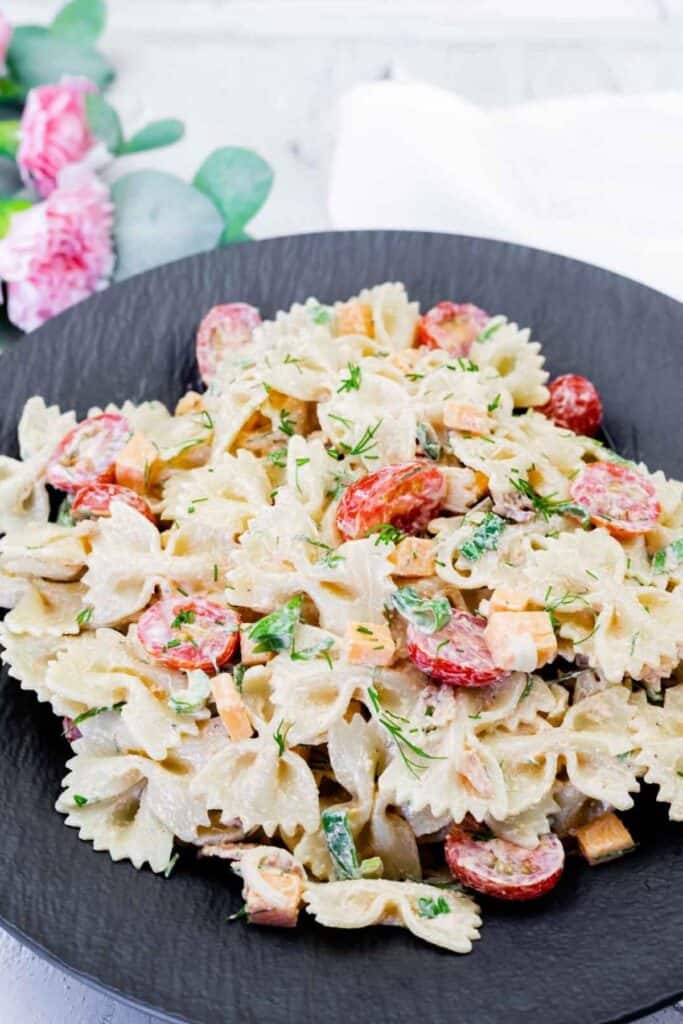 Classic Bacon Pasta Salad on a black plate.