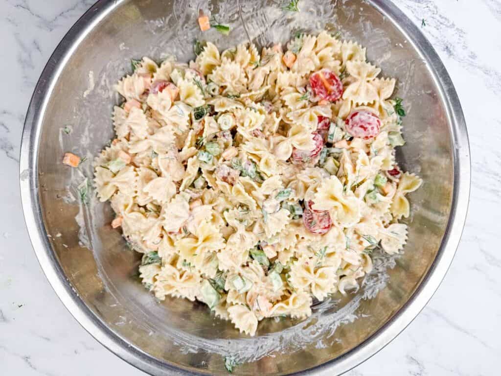 Classic Bacon Pasta Salad on a stainless steel mixing bowl.