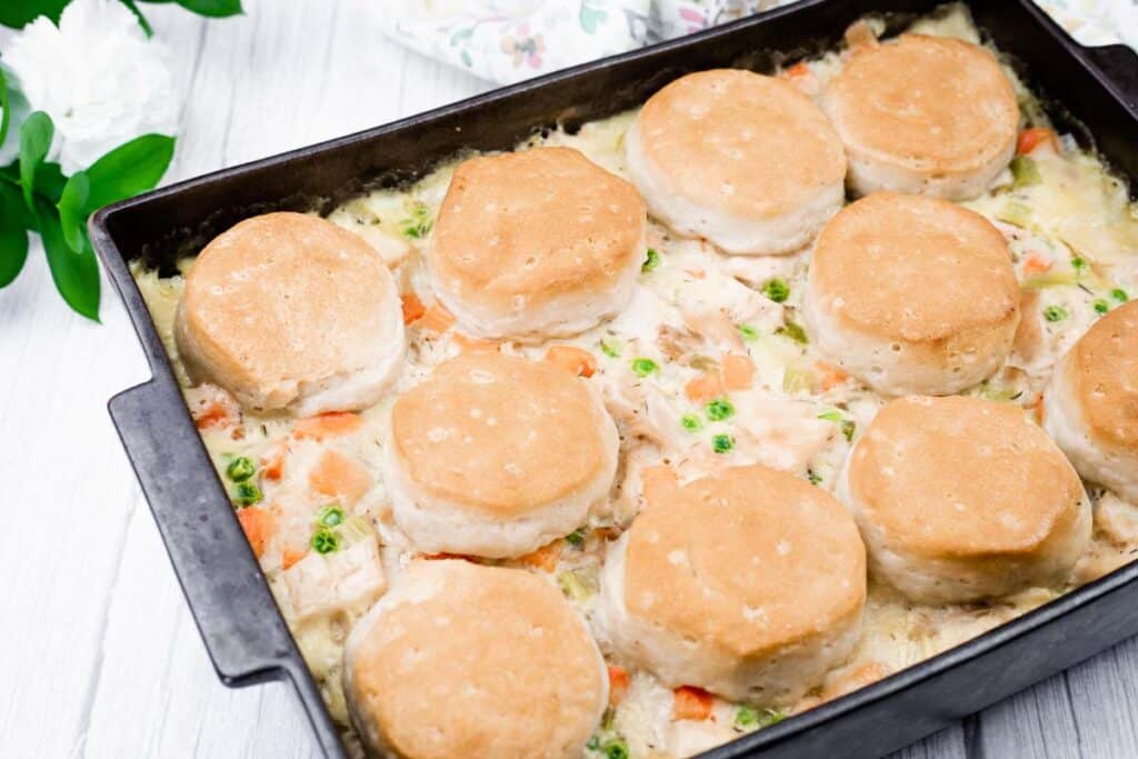 Bite Stuff chicken pot pie with biscuit topping in a baking dish, served hot.