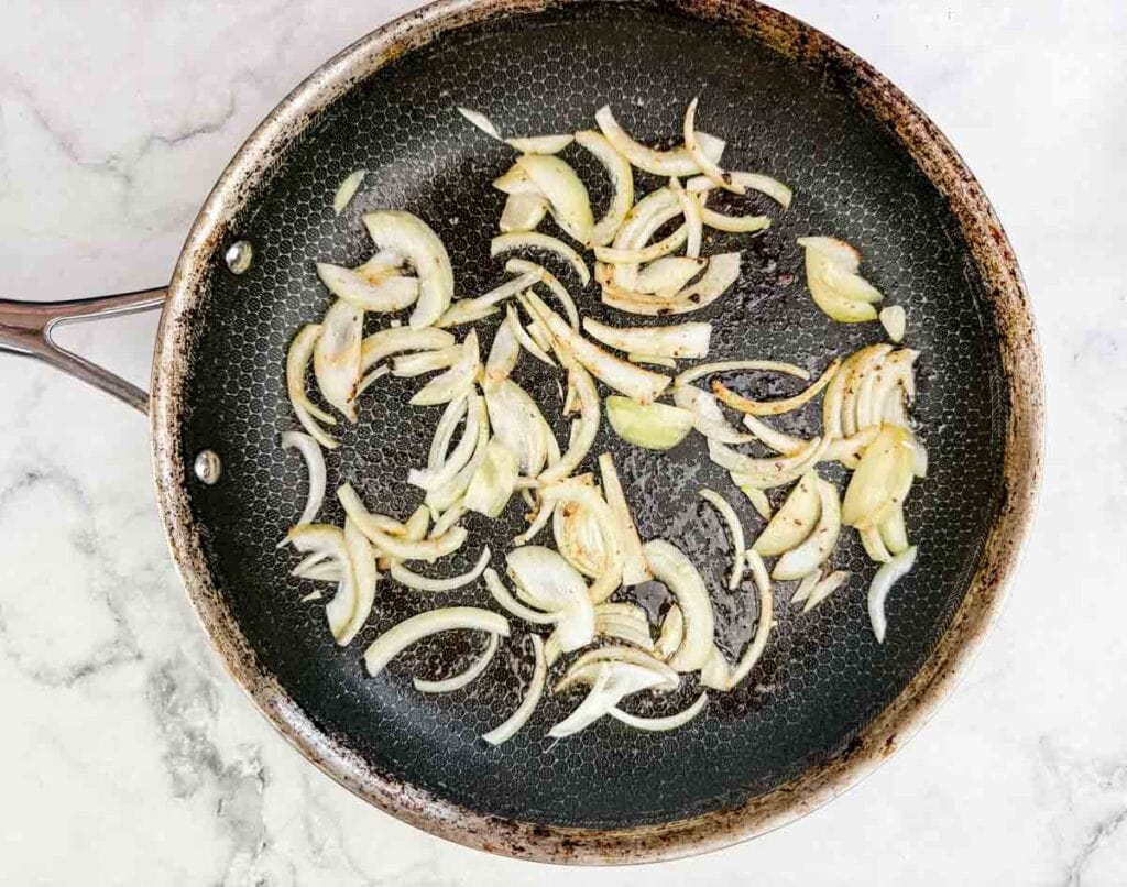 Sauté the onion until softened in a skillet.