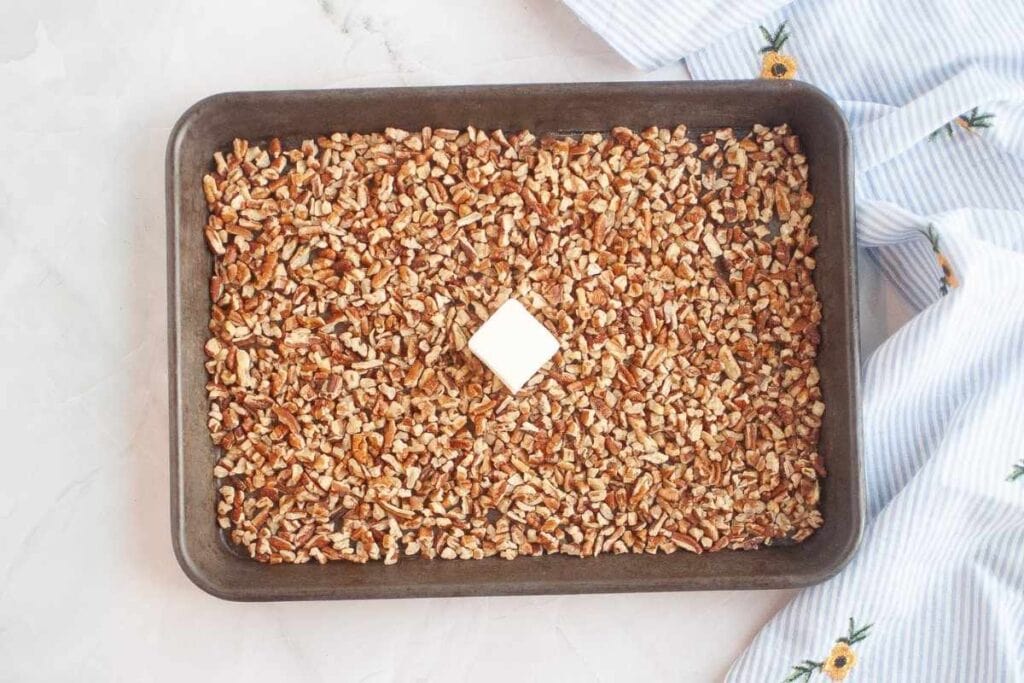 Start by toasting the chopped pecans.