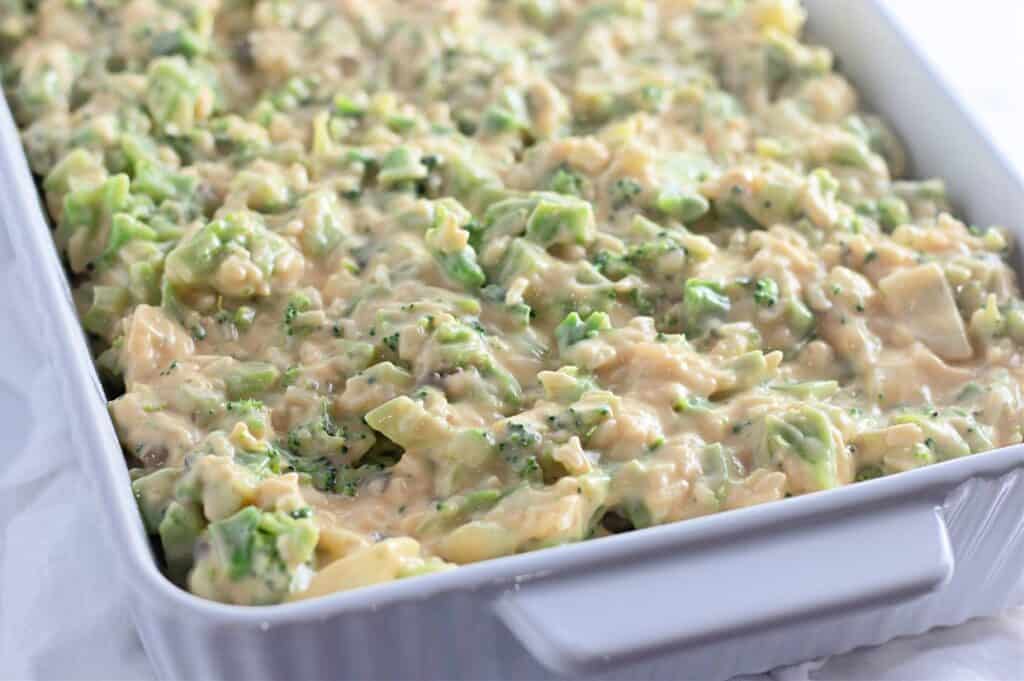 Creamy broccoli cheese potato salad in a white serving dish. Perfect for family gatherings and holidays.