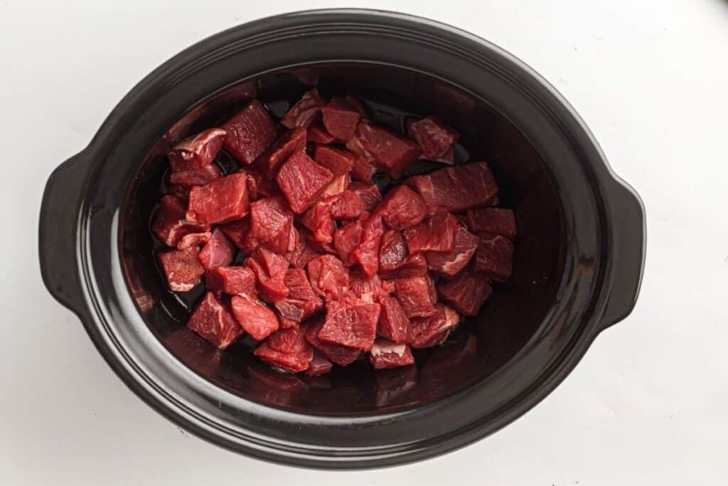 Succulent cubed beef in a slow cooker or pressure cooker for tender, flavorful meals. Perfect for hearty beef dishes and recipes.
