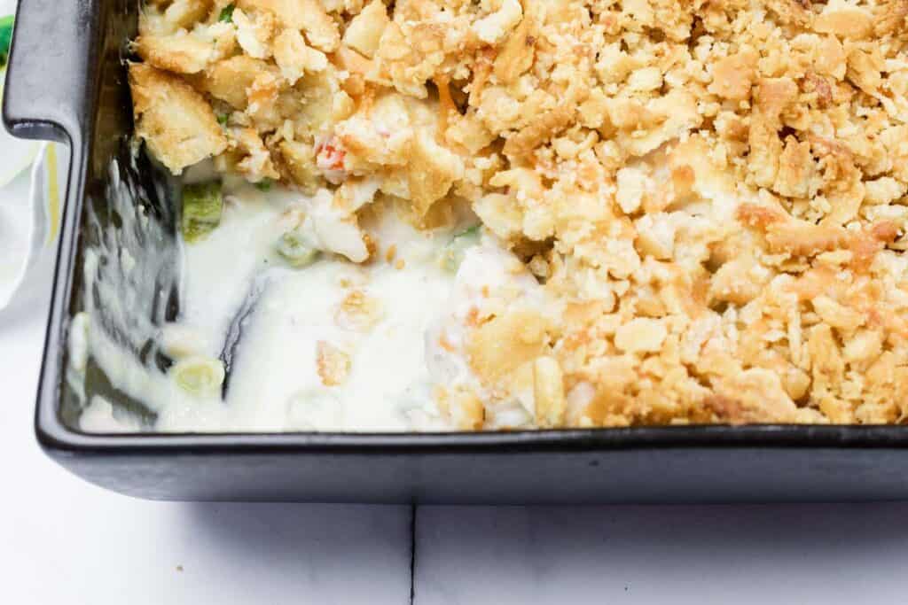 Creamy chicken casserole with a crunchy breadcrumb topping, perfect comfort food from The Bite Stuff.