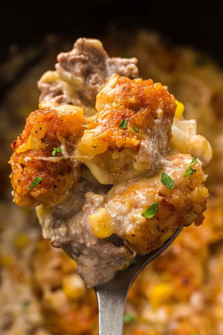 Delicious cheesy beef casserole with vegetables and melted cheese, perfect comfort food.