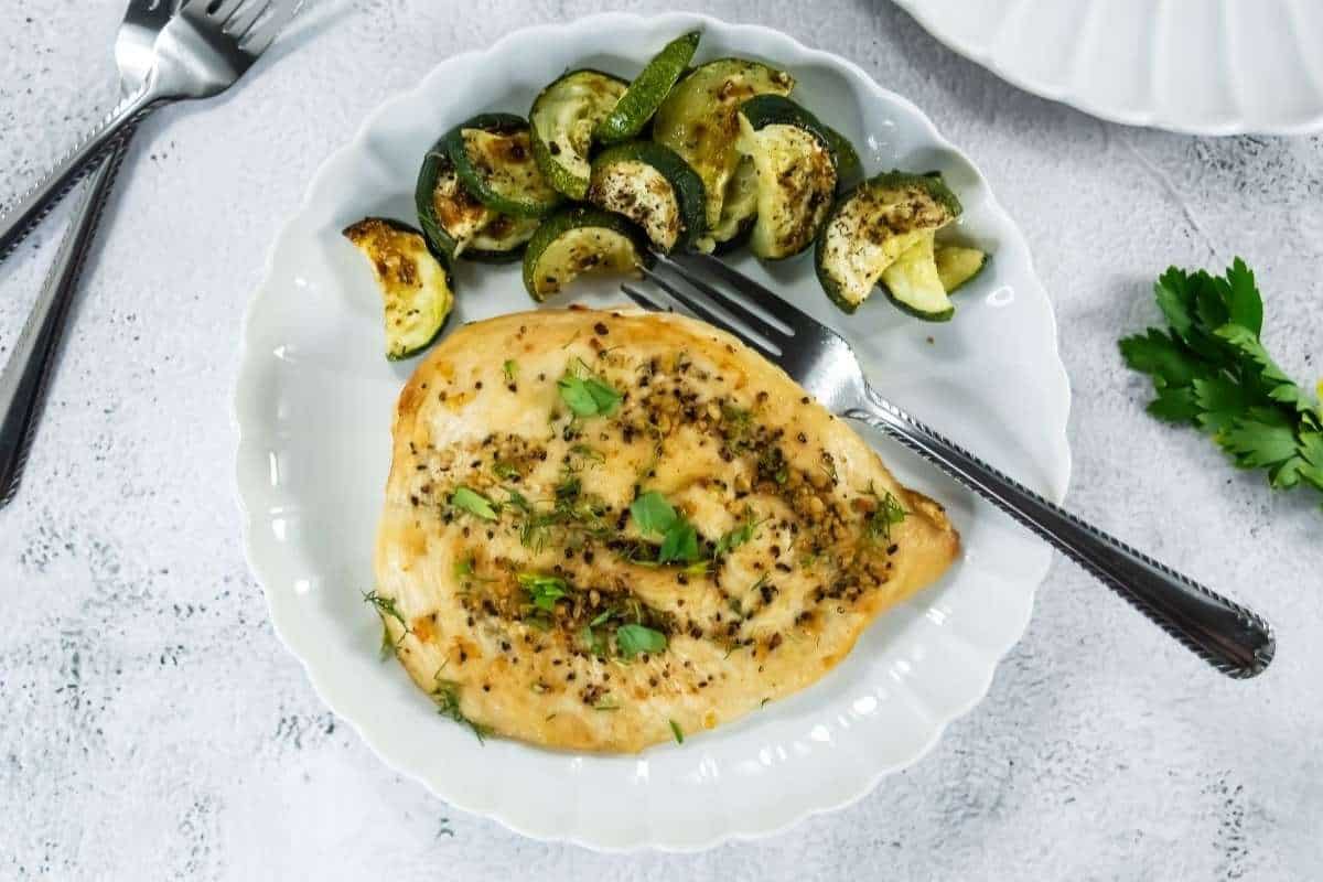 Juicy, golden-brown broiled chicken served on a plate, ready for a quick and flavorful meal.