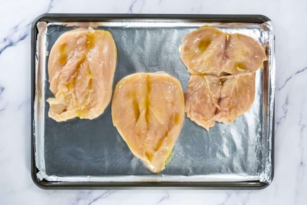 Raw chicken breast fillets ready for baking or grilling.