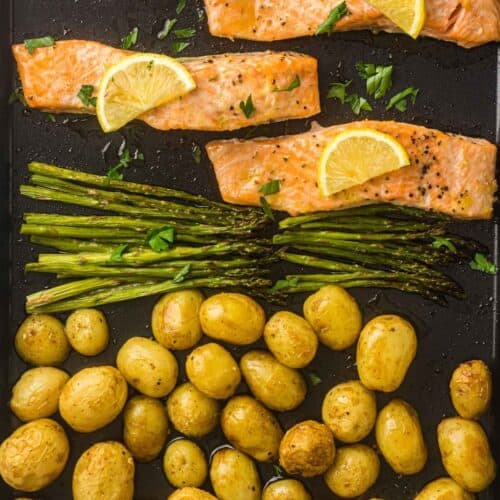 A vibrant sheet-pan dinner with flaky salmon, tender asparagus, and golden roasted potatoes, finished with fresh lemon for a bright, savory touch.