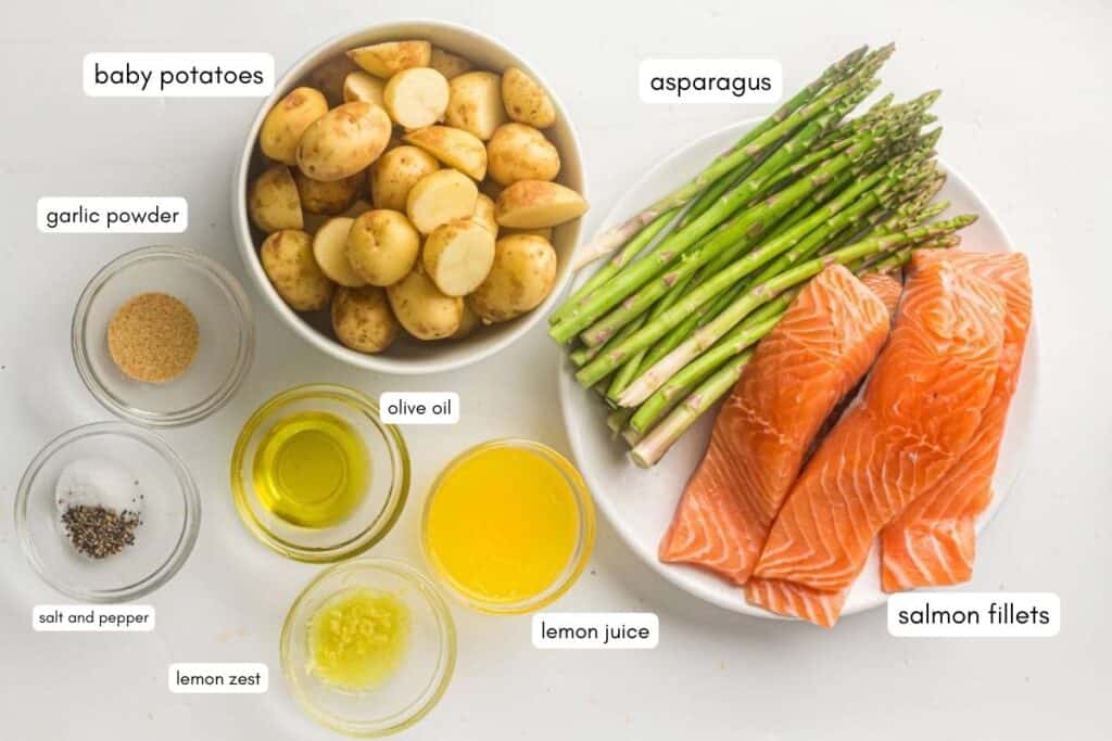 Fresh salmon fillets with baby potatoes, asparagus, garlic, lemon juice & olive oil. Perfect for healthy, flavorful meals.