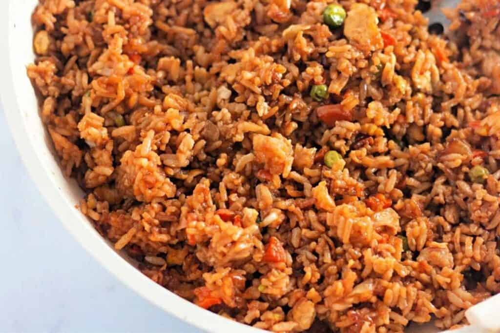 Quick and easy fried rice on a white bowl.