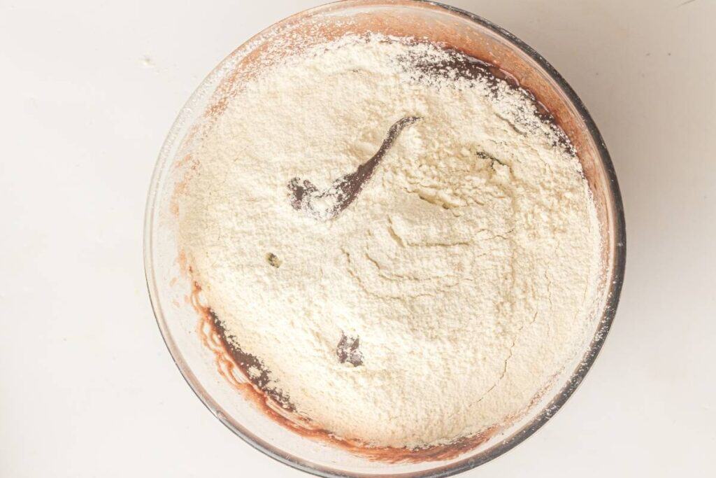 The chocolate mixture has been combined with the flour.