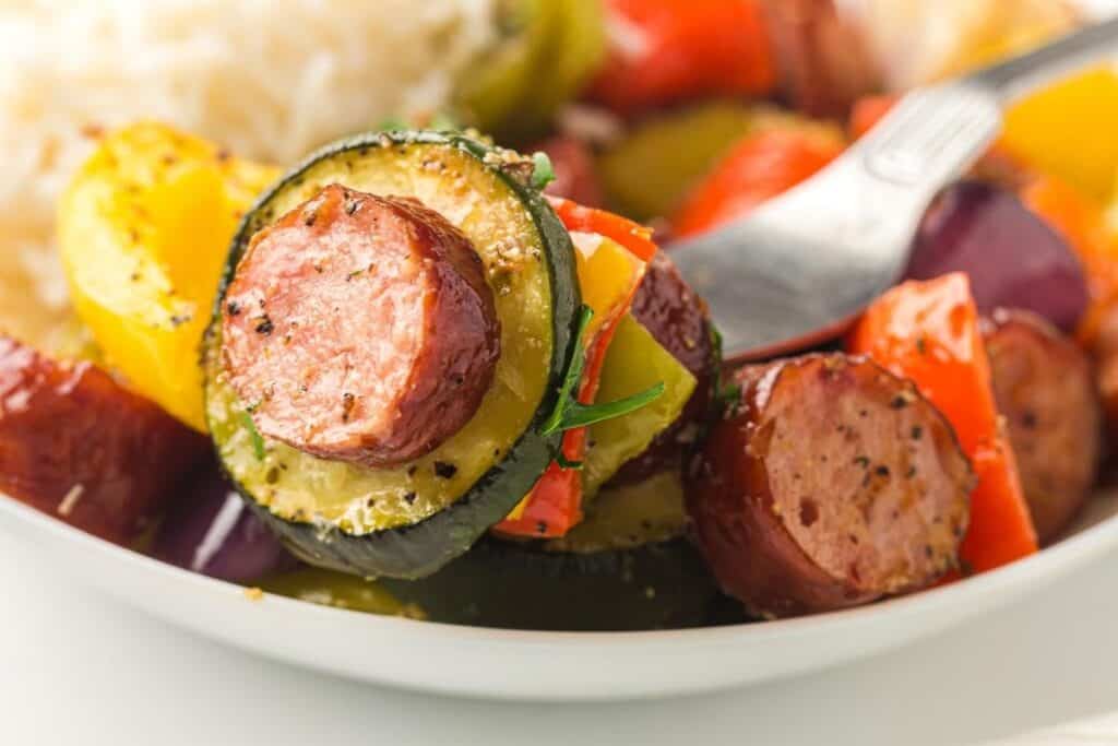 Sausage & Roasted Vegetables on a white plate.