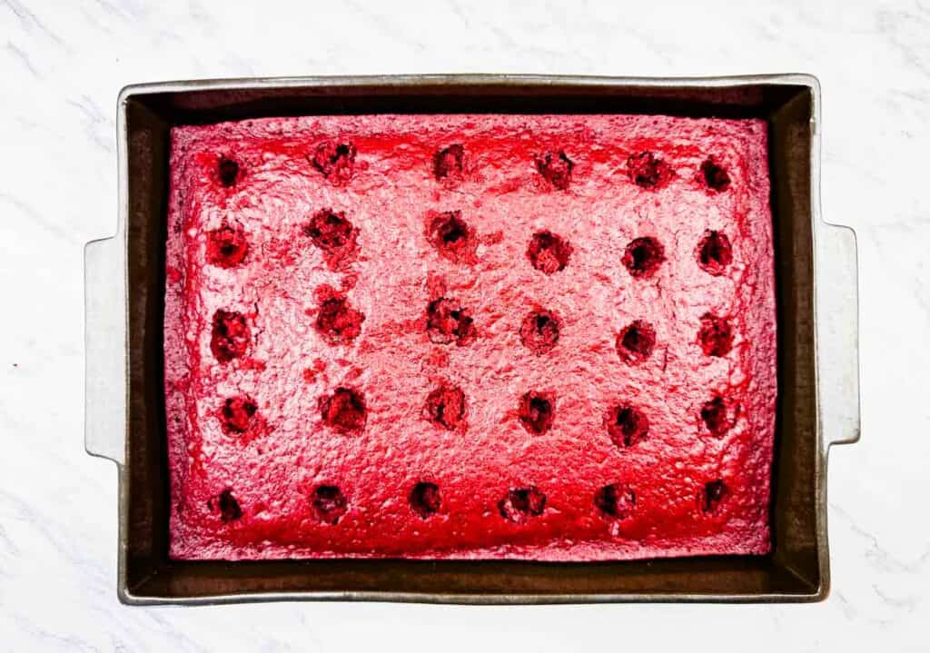 Poke holes evenly across the surface of the cake.