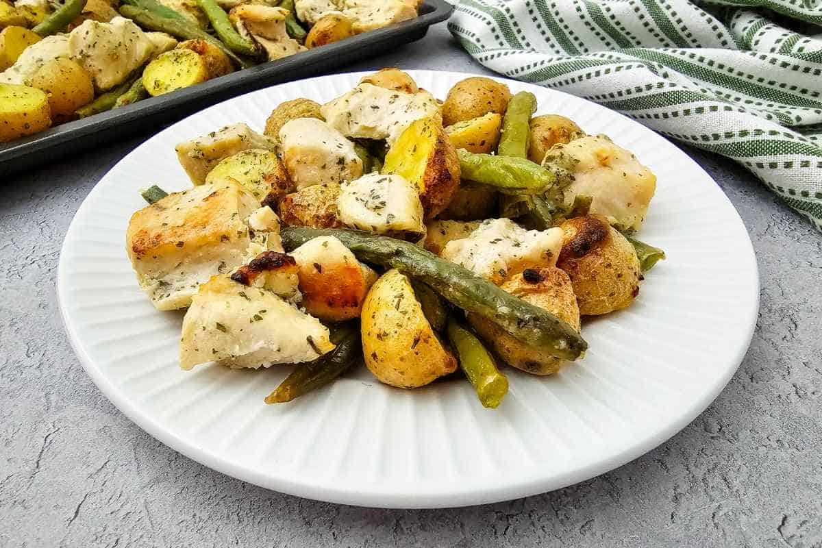 Sheet Pan Ranch Chicken and Veggies roasted with tender chicken and seasoned vegetables on a plate.
