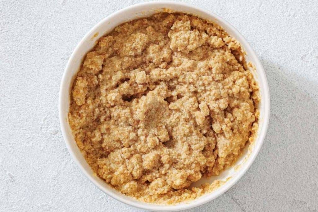 Add the crumbled bread and heavy cream to a small bowl and let the mixture soak for about 10 minutes.