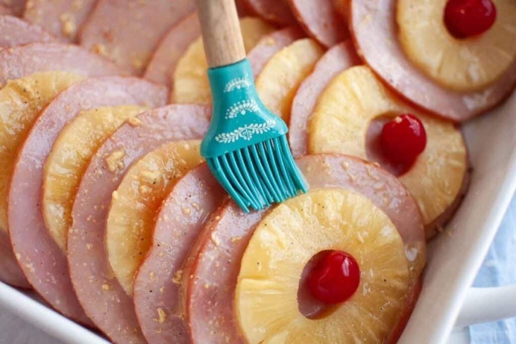 Brush the glaze generously over the ham slices.