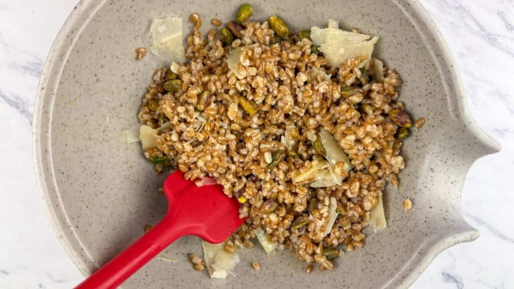 In a medium saucepan, combine the farro, apple cider, kosher salt, bay leaves, and 2 cups of water.