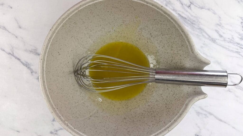 Whisk together the olive oil, lemon juice, and a pinch of salt.