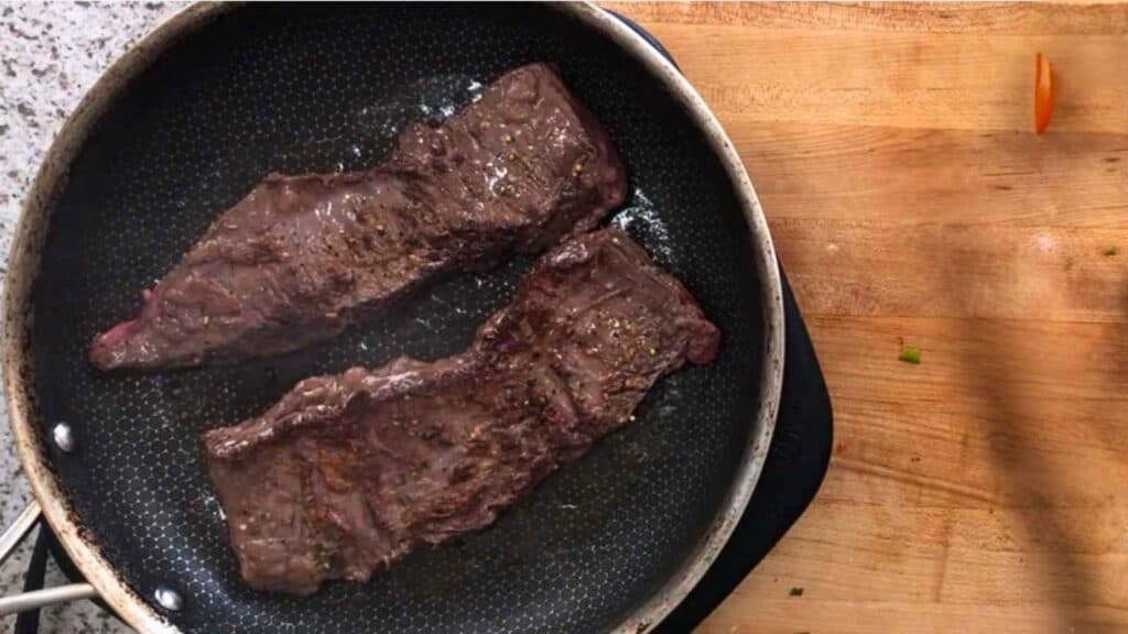 Sear the steak in the same skillet the vegetables just came out of.
