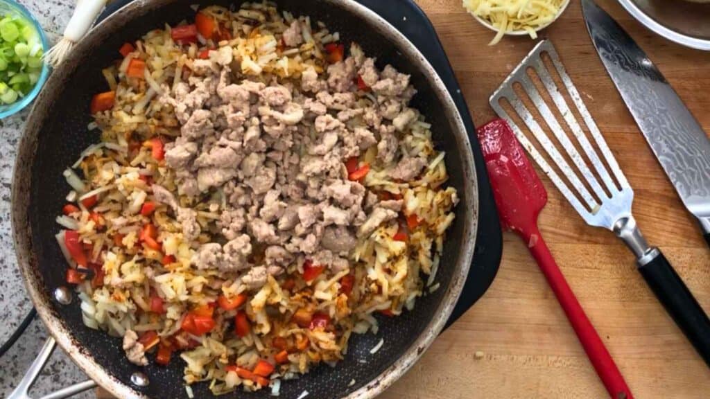 Return the turkey sausage to the skillet and stir until everything is heated through.