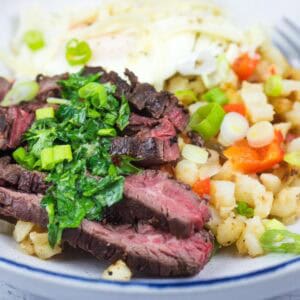 Close-up shot of Steak and Eggs Breakfast Bowl on a plate.