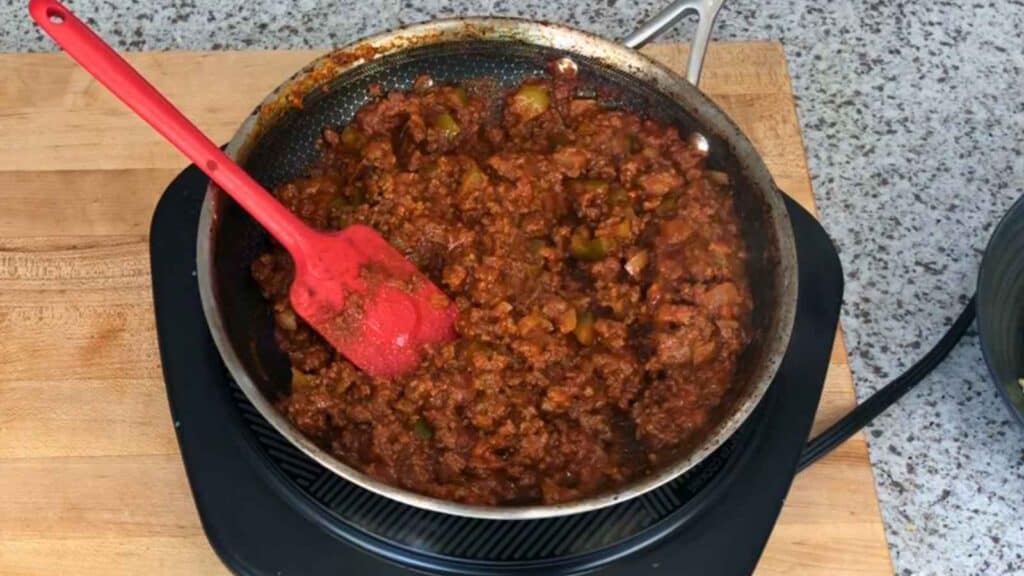 Mix in the tomato sauce, Worcestershire sauce, Dijon mustard, apple cider vinegar, smoked paprika, chili powder, brown sugar, salt, and pepper.
